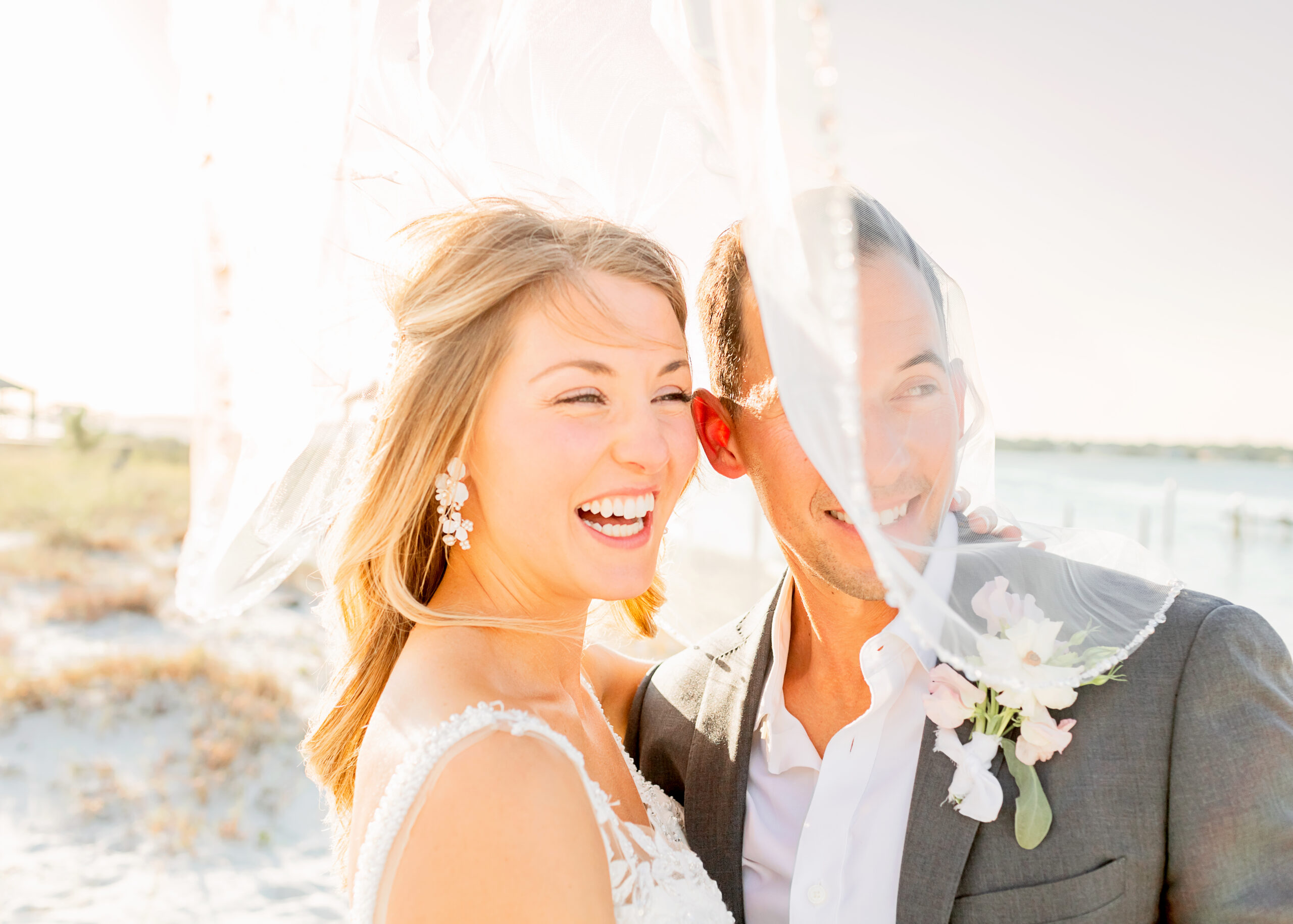 Husband and wife smile after vows for gulf shores wedding photographer
