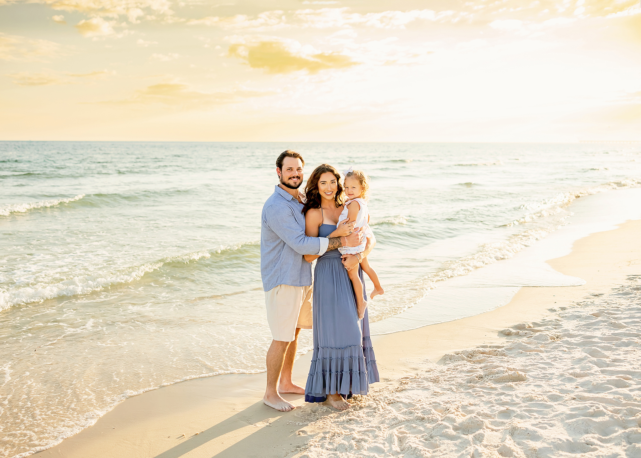 Family poses for prange beach photography along the beach