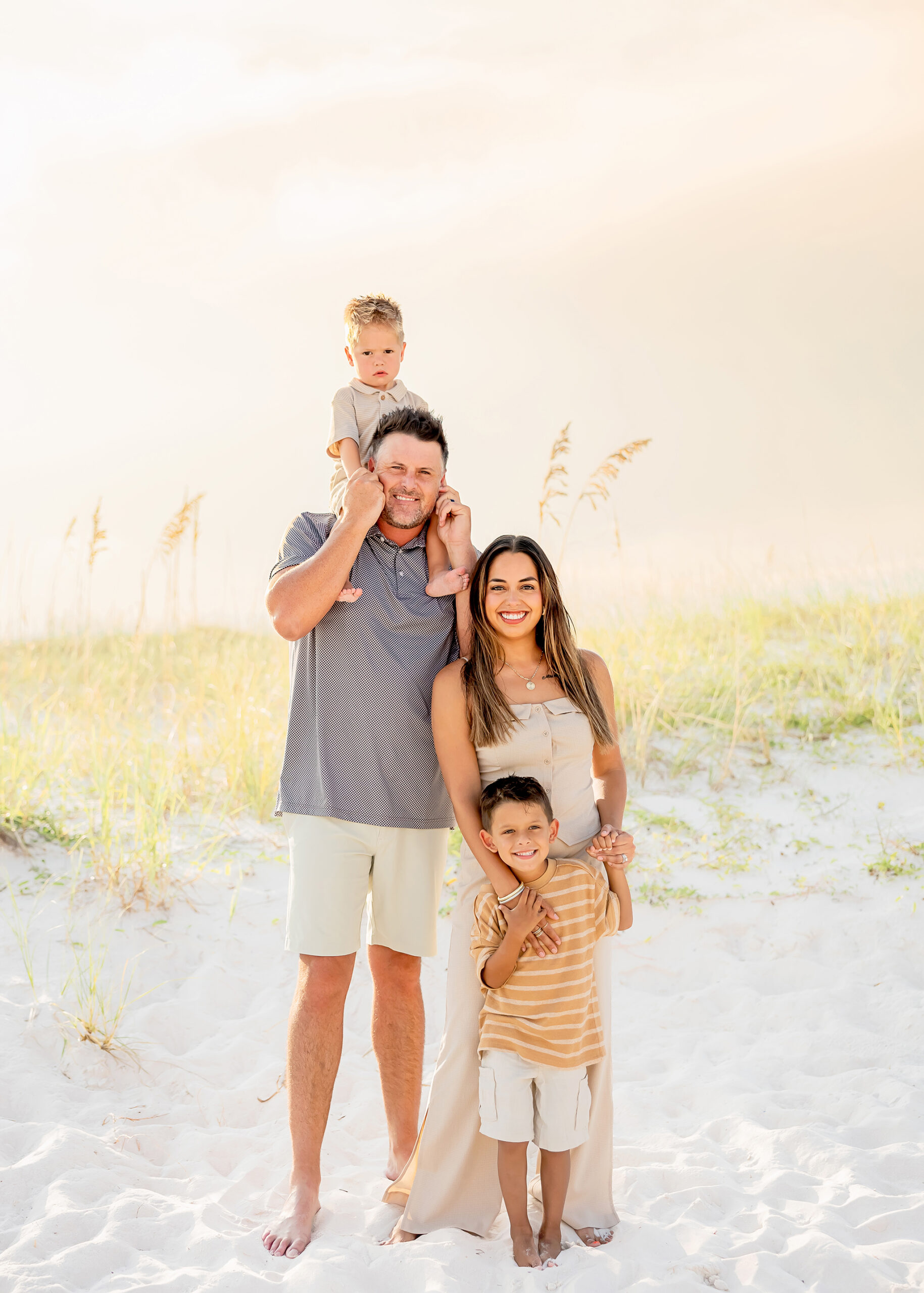 Orange Beach photographer capturing candid family beach photography at sunset
